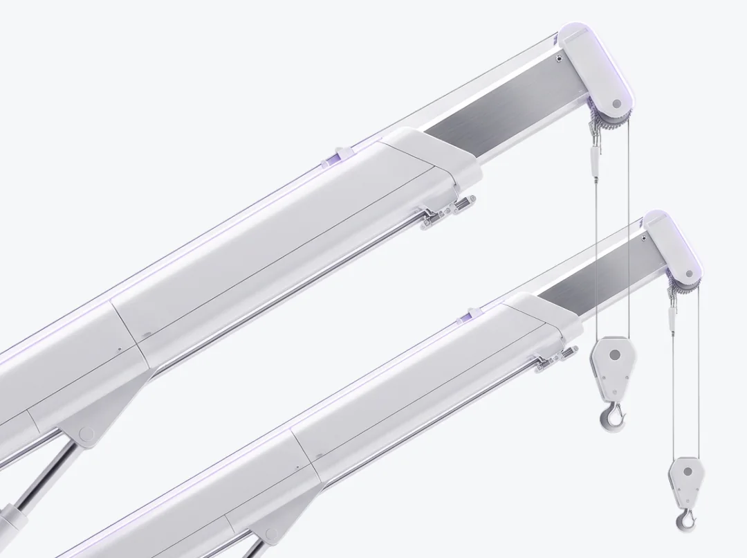 White anodized crane booms and hook blocks with a single amethyst rim light.